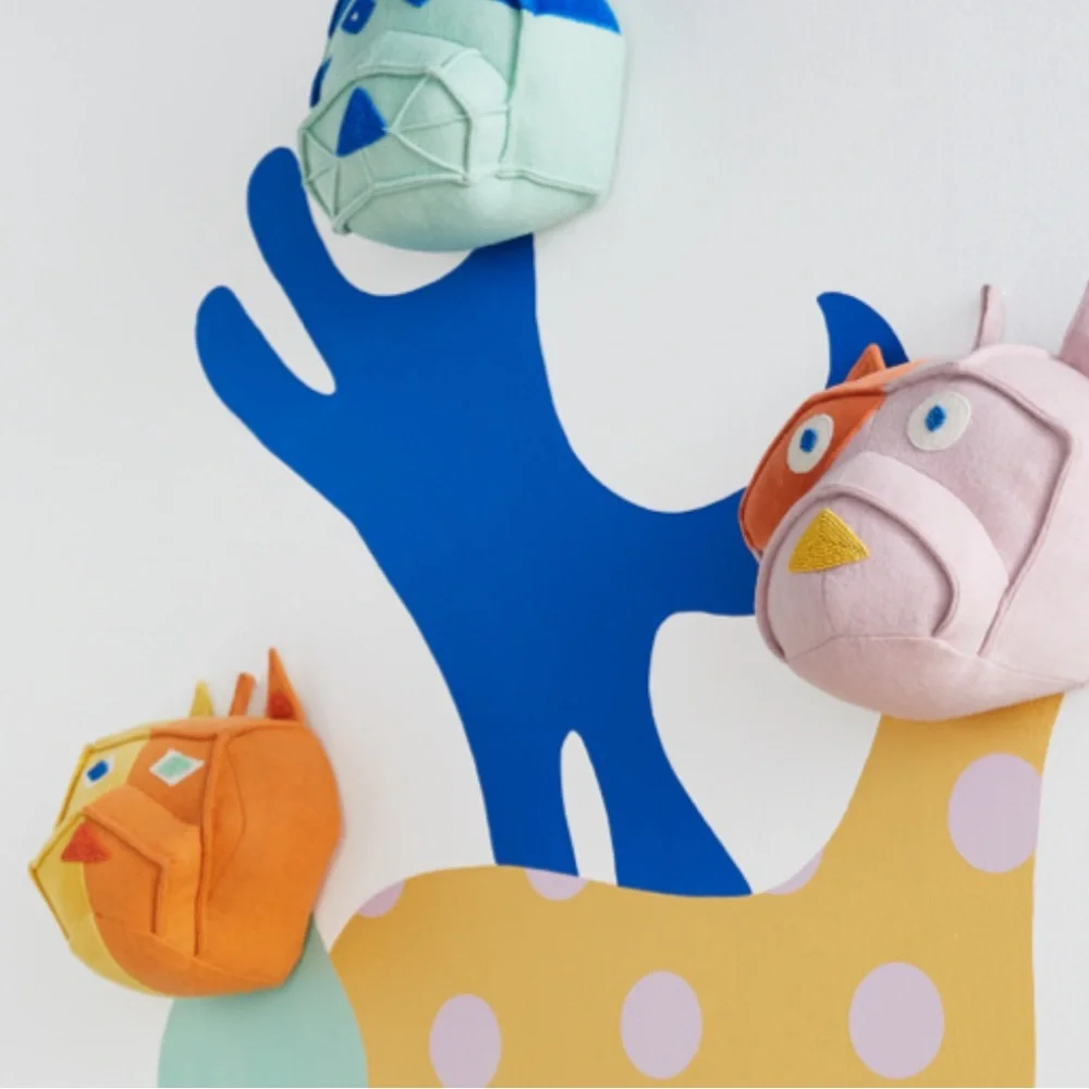 Domino x Crate & Barrel colorful dog head wall decor